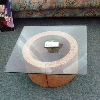 tavolino con base circolare in pietra