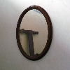 specchio ovale con cornice in legno