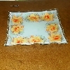 centrotavola quadrato in vetro con fiori arancio